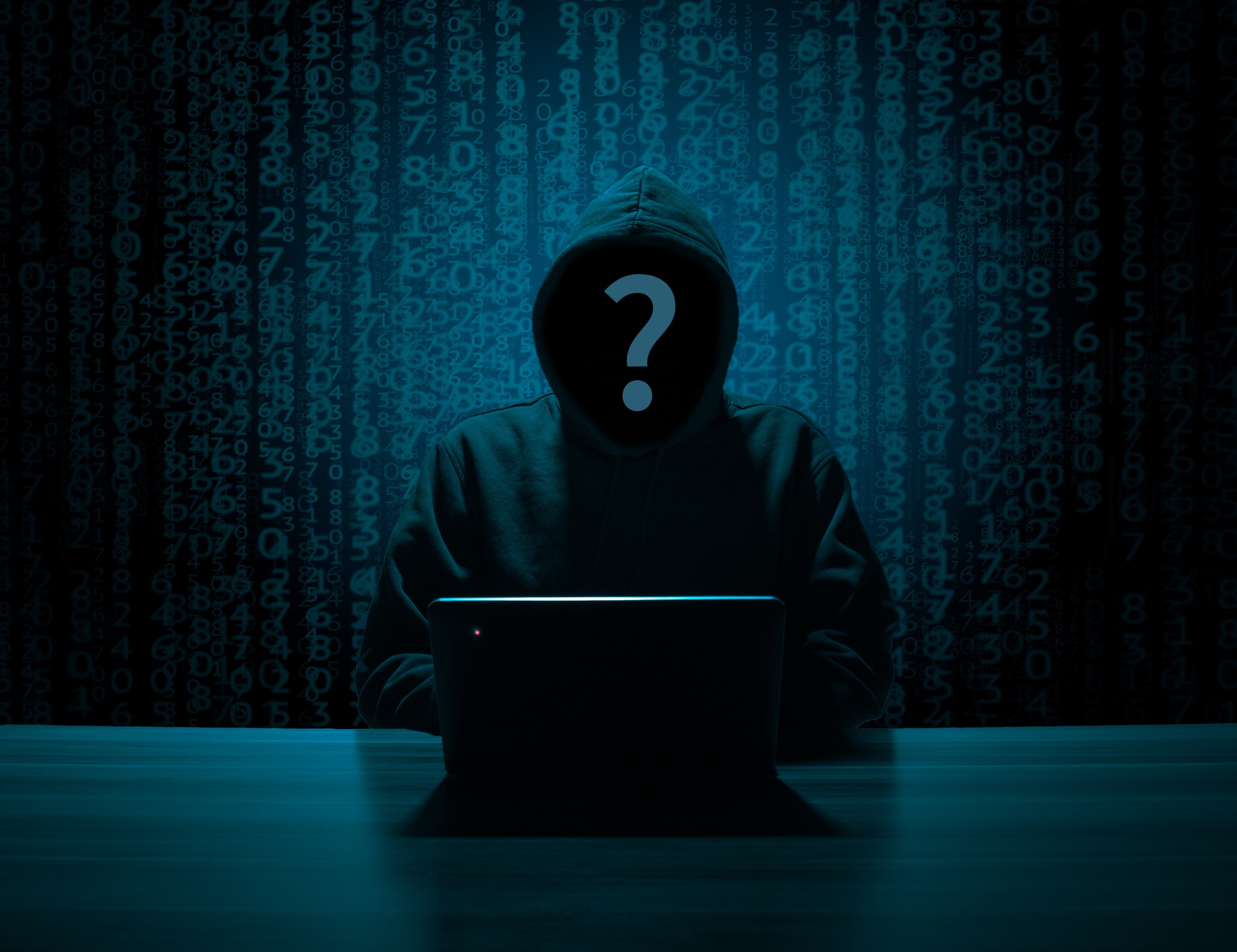Visual representation of social media anonymity, showing a shadowy figure using a laptop with blurred screens and social media icons.