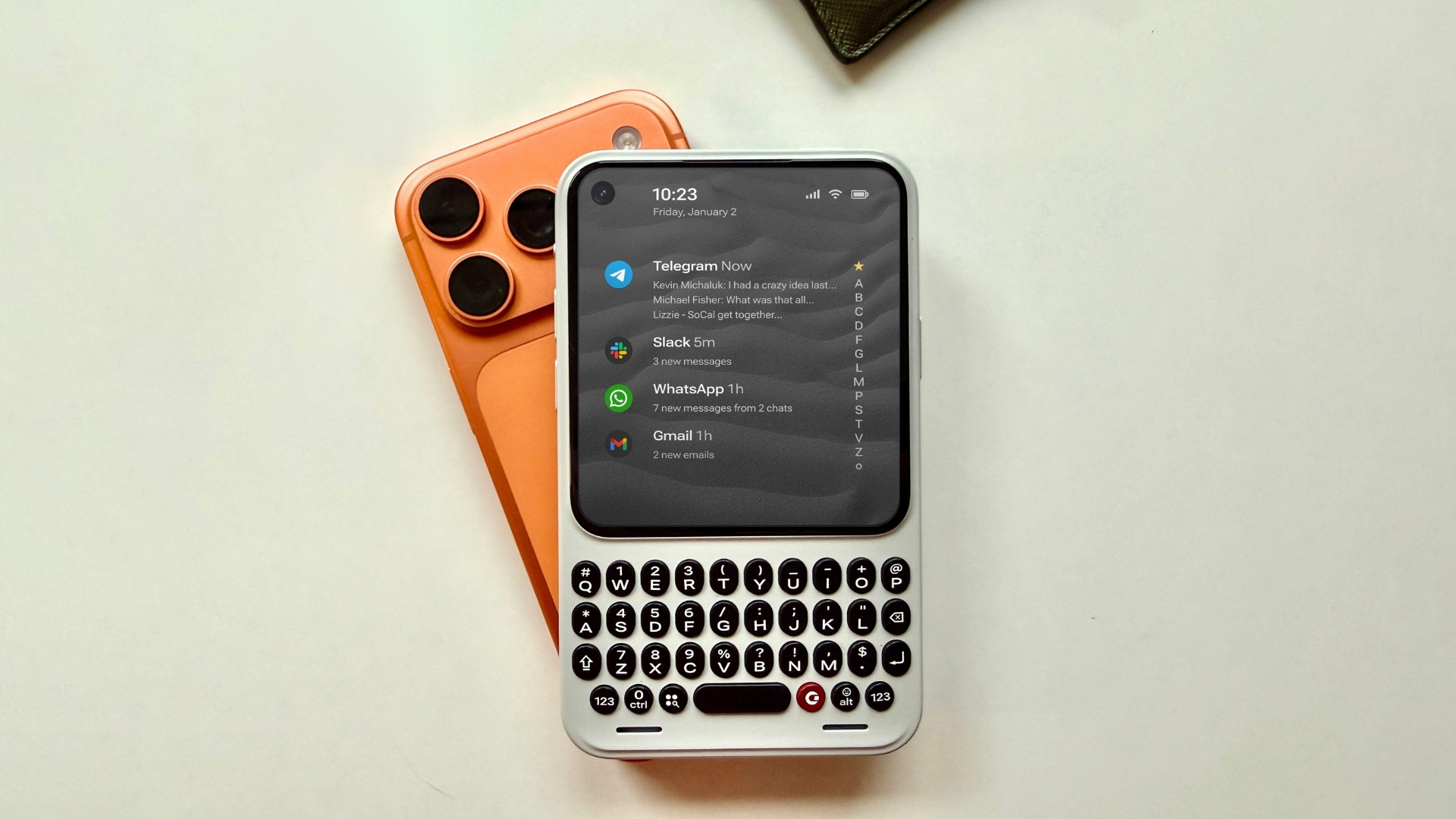 Clicks Communicator smartphone with physical QWERTY keyboard showcased at CES 2026, featuring a modern design and impressive camera specifications.