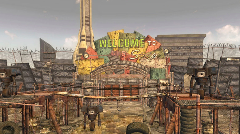 A dramatic scene from the Fallout series finale, featuring characters in a post-apocalyptic Mojave Desert with Lucky 38 casino in the background.